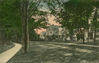 Colour postcard depicting an unpaved streetscape with houses on one side, in Rosedale, with cap ...