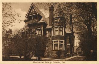 Sepia toned photograph of a three story Victorian building which was once a grand house.