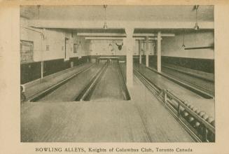 Black and white photograph of a bowling lanes.