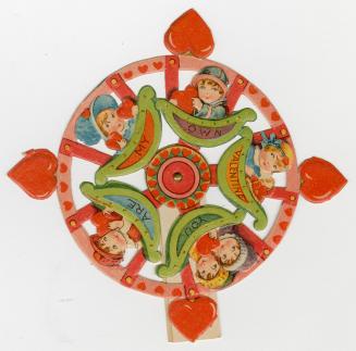 A mechanical card. It is shaped like a wheel with four hearts sticking out at regular intervals ...