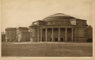 Black and white photograph of a large Beaux-Arts building with a domed roof.