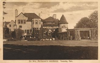 Sepia-toned postcard depicting an image of the frontal exterior of a large home. The caption at ...