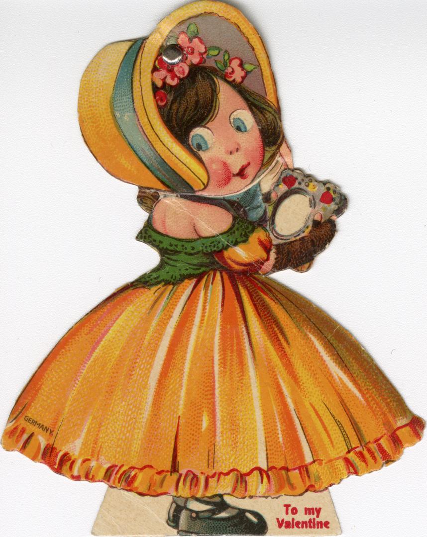 A mechanical card. A girl in a yellow and green dress and a fancy bonnet holds a card with hear ...