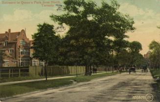 Picture of wide street with trees and buildings on left. 