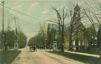 Colorized photograph of a horse and wagon on a dirt road in front of a large church.