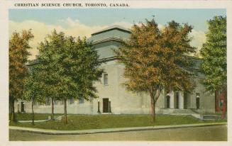 Colorized photograph of a huge, square building with trees in front of it.