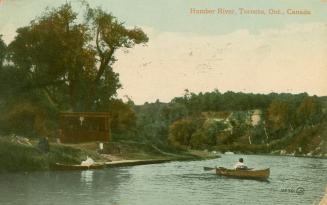 Colorized photograph of two people in two canoes on a river.