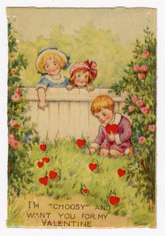 A boy kneels in a garden picking hearts that are growing in the grass like flowers. Two girls w ...