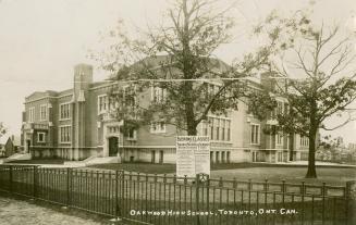 Black/white postcard depicting the exterior of Oakwood Highschool in Toronto. Caption states, " ...