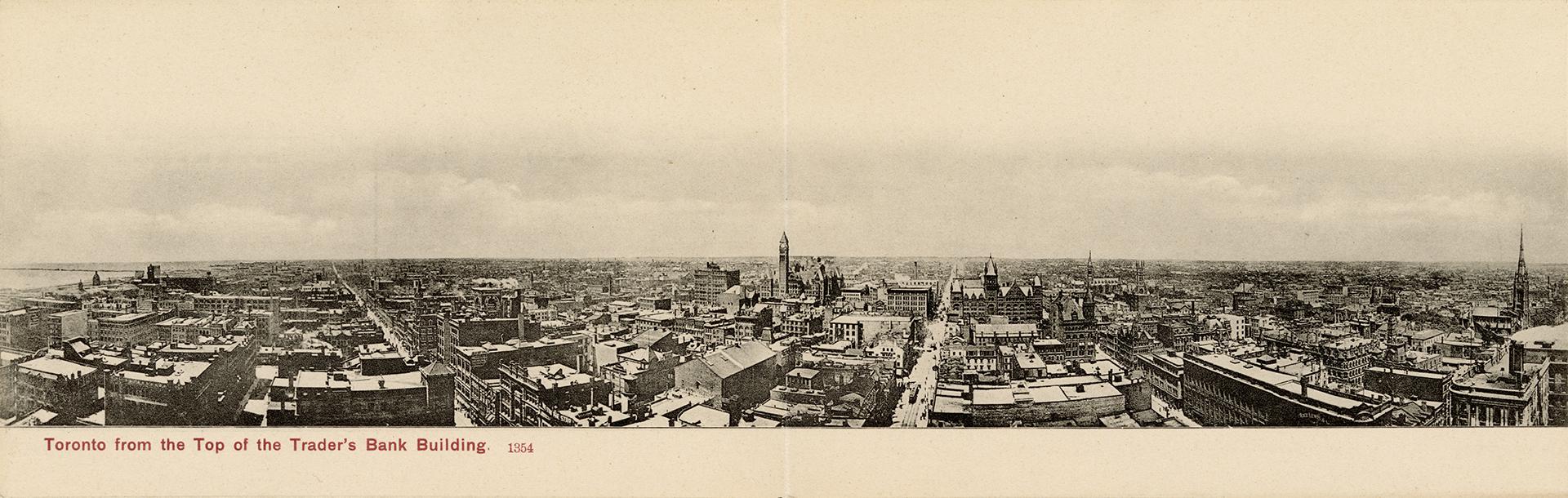 Black and white photograph of a large city taken from a position many stories up a skyscraper.