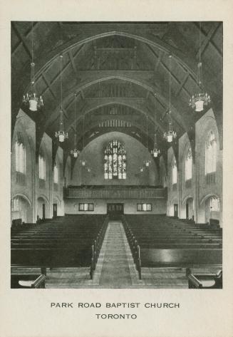 Black and white photograph of the interior gothic style church.
