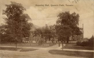 Sepia-toned photo postcard depicting a building with a circular driveway, with caption at the t ...