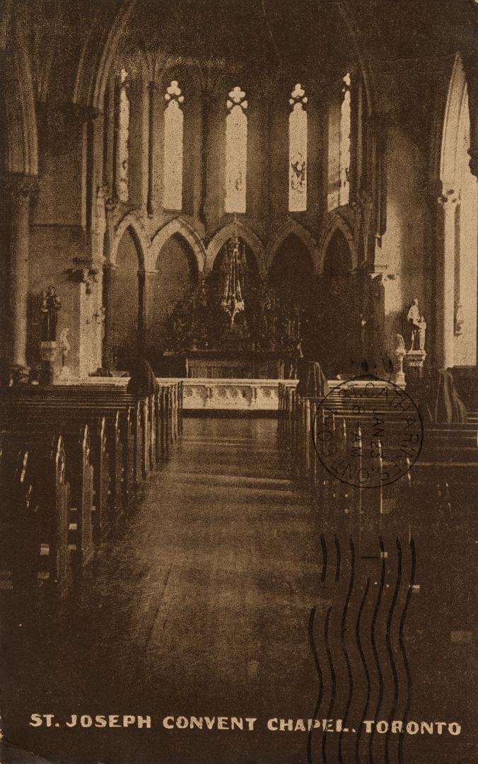 Sepia toned picture of the sanctuary and pews inside a gothic revival church.