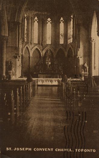 Sepia toned picture of the sanctuary and pews inside a gothic revival church.