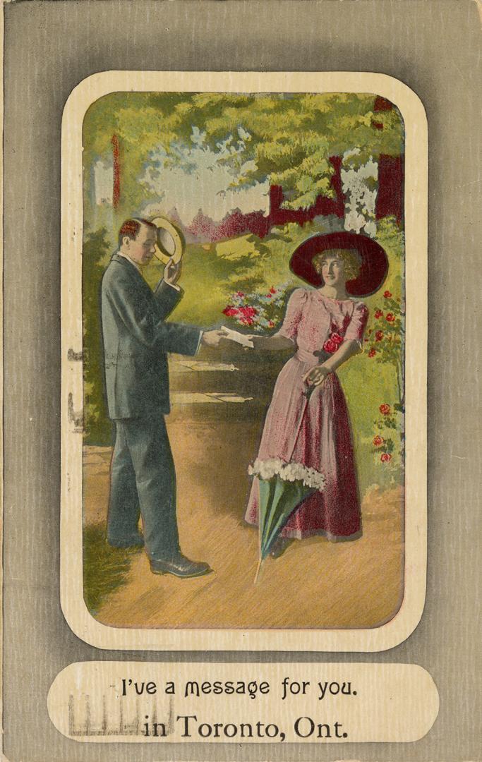A man reaching out to take a woman's hand in a park.