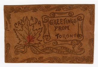 Scrollwork and a maple leaf design burnt into leather.