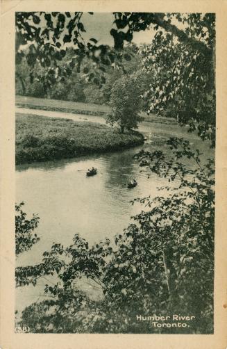 Black and white photograph of two boats on a meandering river.