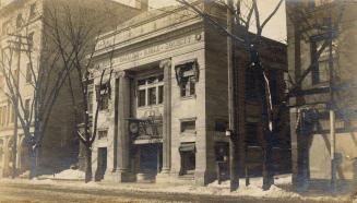 A photograph of a two story building in an Edwardian Beaux Arts Classical Revival style, with t…