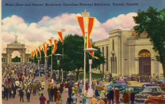 Colorized photograph of a large crowd walking on a pathway with flags and large stone gate in t ...