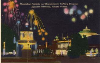 Colorized photograph of fireworks set off behind a large illuminated fountain. Night time pictu ...