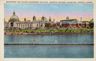 Colorized photograph of a body of water with huge arena type buildings on the shoreline.