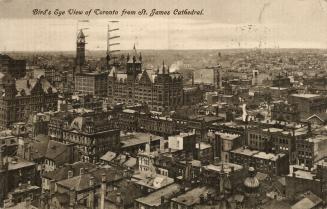 Sepia toned photograph of an aerial view of a large city downtown area with skyscrapers. 
