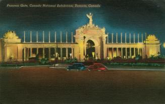 Colorized photograph of a large, neoclassical archway made of cement and stone. Floodlights are ...