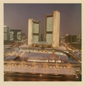 A photograph of Toronto City Hall, which consists of two round office towers on either side of  ...