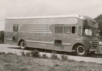 Picture of a parked bookmobile bus. 