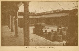 Sepia toned photograph of a central courtyard surrounded by classical columns.