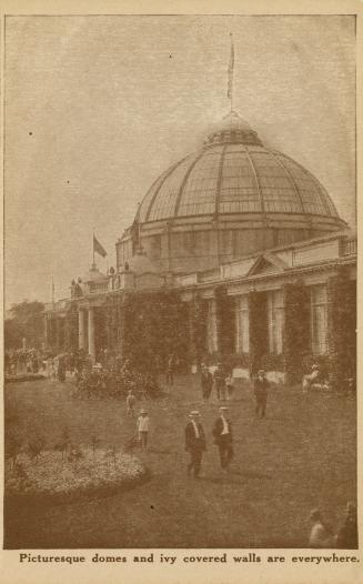 Sepia toned photograph of crowds of people standing in front of a huge Beaux Arts biding with a ...