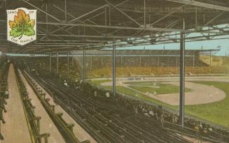 Colorized photograph of players on a baseball field taken from the stands.