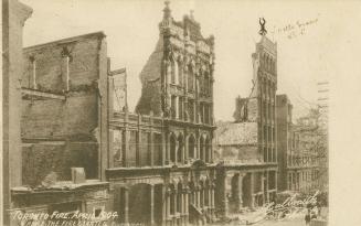 Black and white photo postcard depicting a row of buildings damaged by the 1904 fire of Toronto ...
