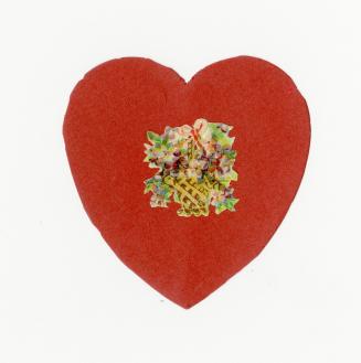 A handmade red heart. A picture of flowers in a basket tied with a pink bow is glued to the cen ...