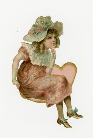A girl wearing a pink dress and a bonnet with flowers on it. She sits on a heart-shaped chair w ...