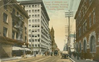 Colorized photograph of very tall buildings surrounding an downtown city street.