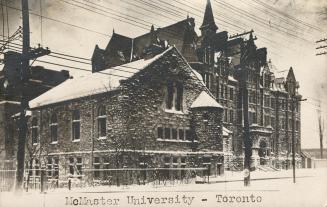 Black and white photograph of two very large buildings of late Victorian design.