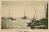 Black and white photo postcard depicting the harbour at the Toronto Canoe Club with boats and c…