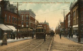 Colorized photograph of buggies, pedestrians and streetcars on a busy city street.