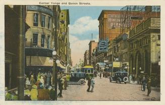 Colorized photograph of a very busy city street corner with automobiles and a streetcar.