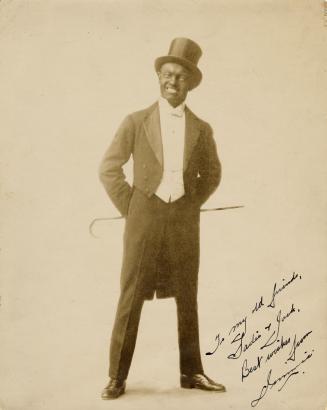 Black and white photograph of Jimmy Goode of the Dumbells in costume.