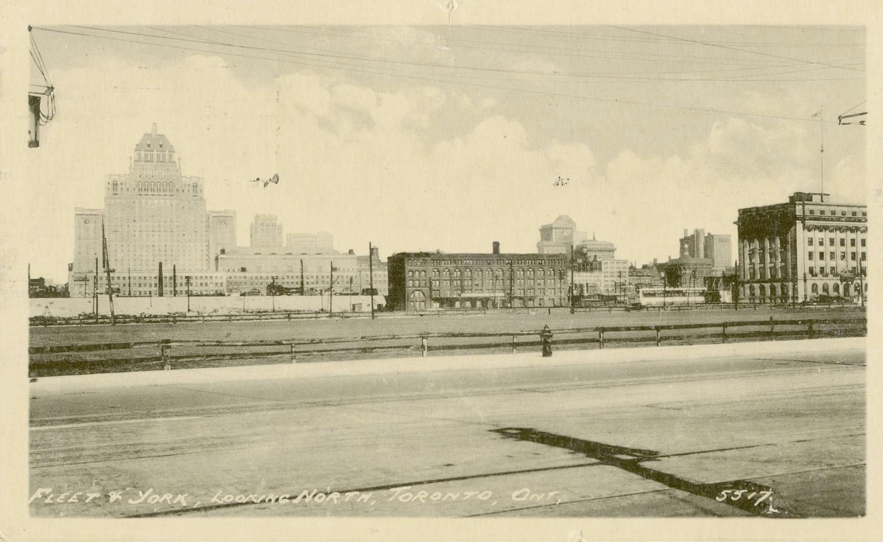 Black and white photo postcard depicting a view looking north from Fleet and York Streets. The  ...