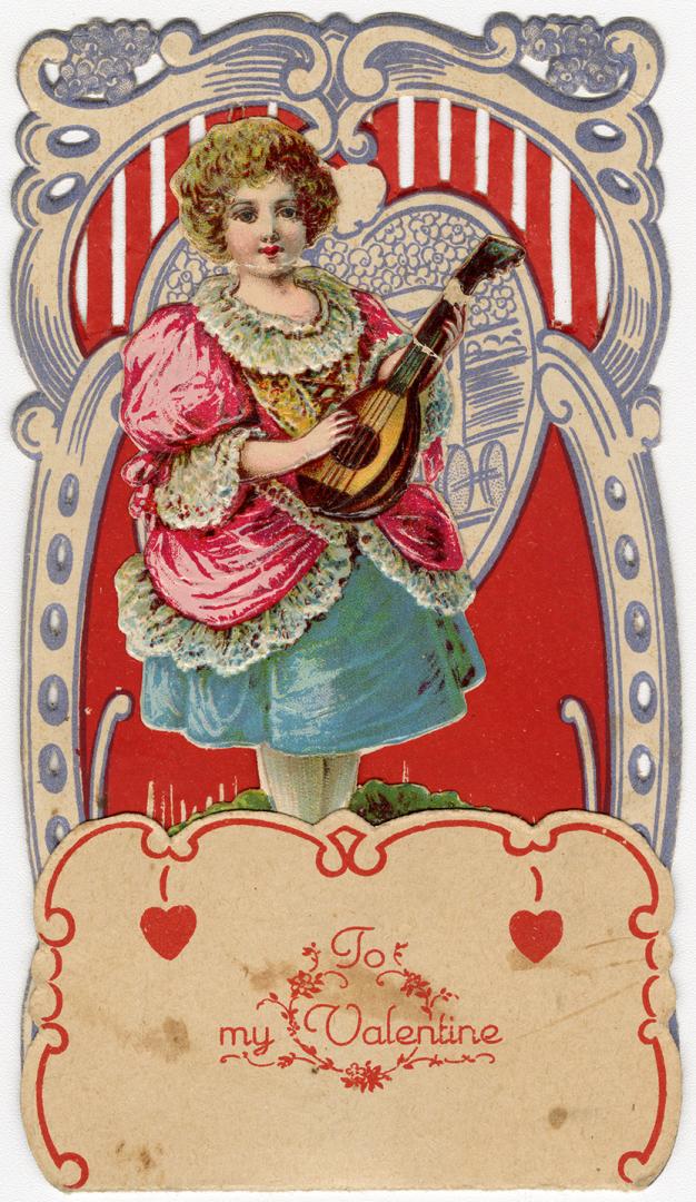 A pop-up card.A girl holding sting instrument stands on a patch of grass with flowers nearby. T ...