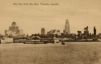 Black and white photograph of steamships and boats on the water beside a large city.