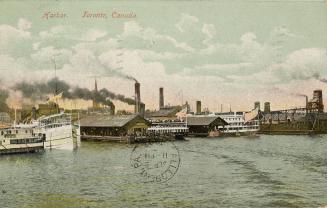 Colorized photograph of a steam boats moored at busy, city docks.