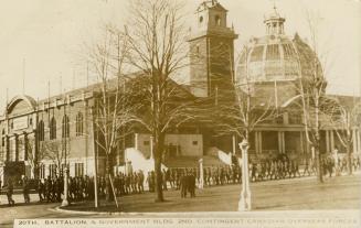 Black and white photograph of lines of servicemen i front of a large public building with a dom ...