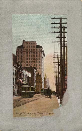 Colorized photograph of very busy city street with tall buildings on either side. Streetcars, p ...