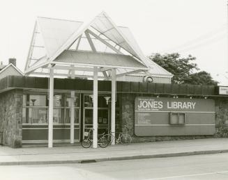 Picture of one storey library building with new portico. 