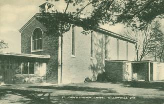 Black and white photograph of a two story church building.