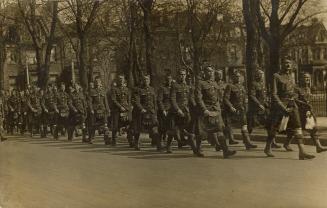 Black and white picture of soldiers on parade.